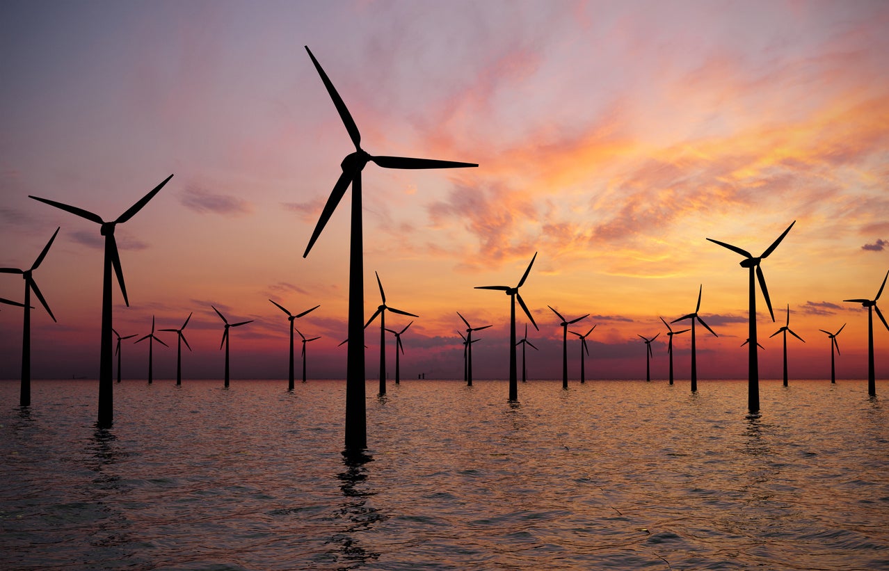 Offshore Wind Turbines Farm at Sunset