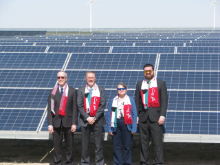 Figure 1. Gerry Wiener, Branko Kosovic, Sue Ellen Haupt, and Jared Lee at the 10-MW PV solar plant at the Shagaya Renewable Energy Park for its Grand Opening on 20 Feb 2019.