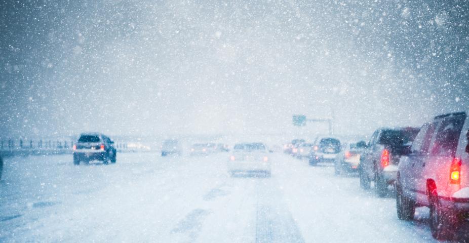 snowy highway with heavy traffic