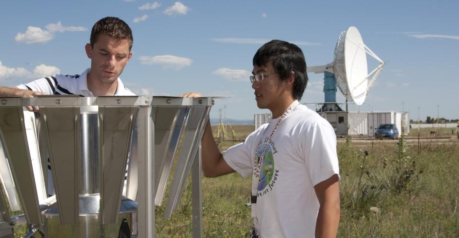 Scott Landolt, NCAR scientist, works with high school intern, Andy Sun, at the Marshall Field Site.