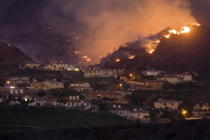 Hillside neighborhood in California engulfed in a wildland fire