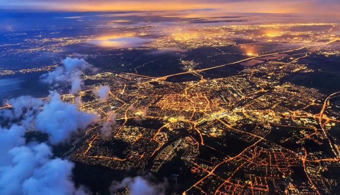 Beautiful aerial cityscape view of the city of Leiden, the Netherlands, after sunset at night in the blue hour