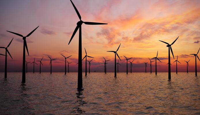 Offshore Wind Turbines Farm at Sunset