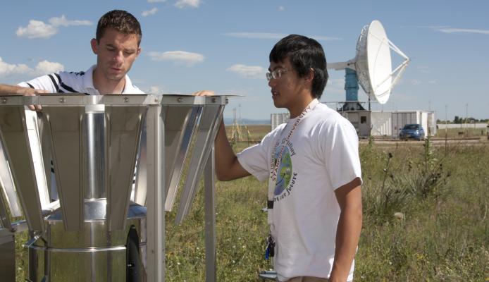 Scott Landolt, NCAR scientist, works with high school intern, Andy Sun, at the Marshall Field Site.