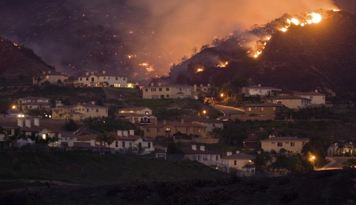 Hillside neighborhood in California engulfed in a wildland fire
