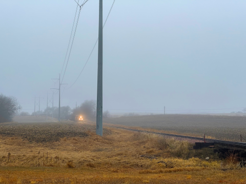 Train traveling in heavy fog