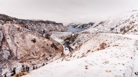 View from above of Anderson Ranch Dam in the winter, covered with snow, located on the South Fork of the Boise River in Idaho.