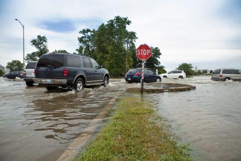 Traffic at a flooded street in suburban Chicago, Illinois