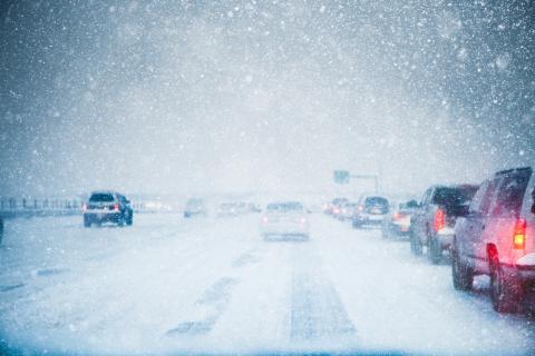snowy highway with heavy traffic