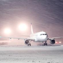 Plane parked at the airport in winter