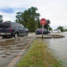 Traffic at a flooded street in suburban Chicago, Illinois