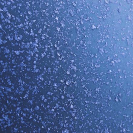 Snowflakes on metal surface